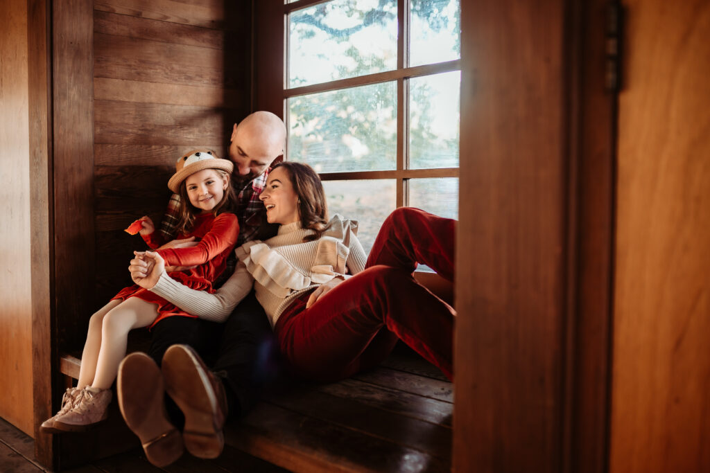 lifestyle family photography with family in idyllic setting and genuine emotion