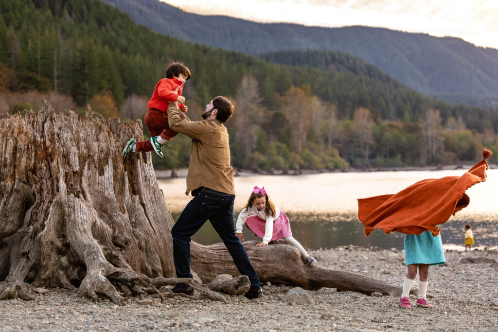 Father and children playing on stumps at Rattlesnake Lake.  Photo by Telly Dez Photography